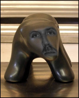 Image of DMH's face photoshopped onto a black walking Polar bear sculpture. Image by Jon Hershey.